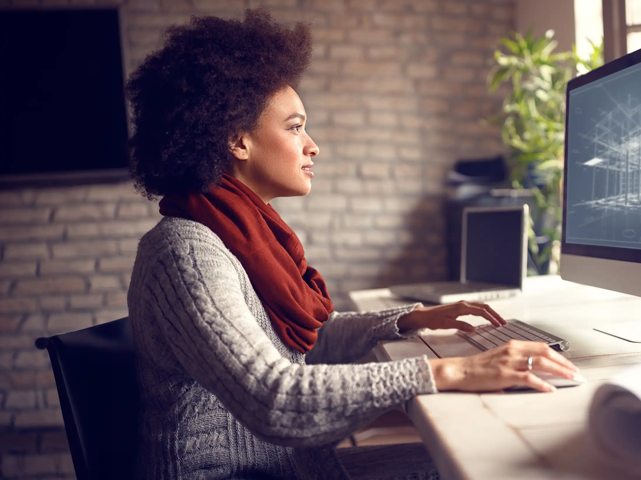 Female works on architect project at her workplace